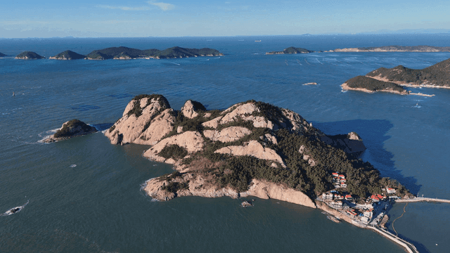 A scenic island surrounded by blue sea