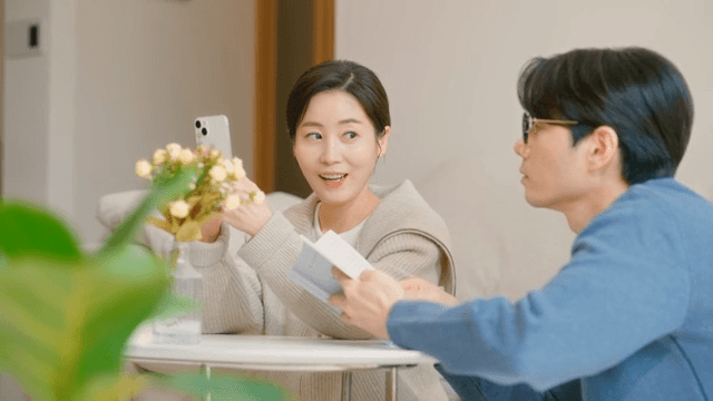 Couple talking while looking at their smartphones