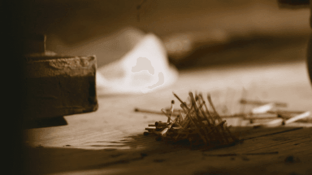 Hand that breaks down stack of matchsticks