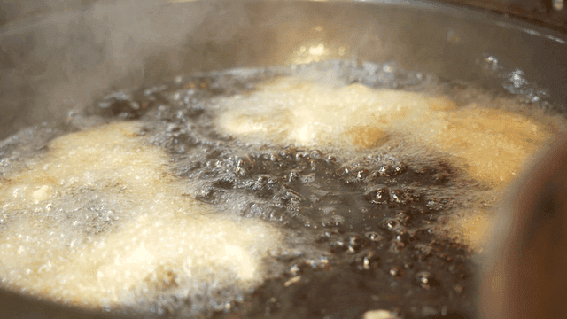 Sight of food being fried in hot oil