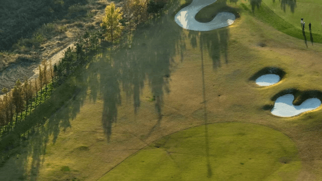 Golfers playing on a sunny course