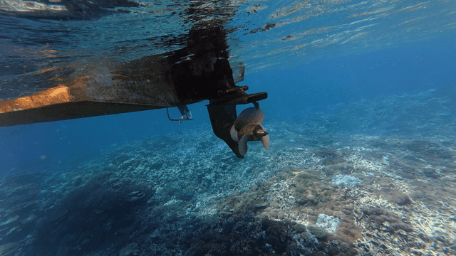 Underwater view of a boat propeller