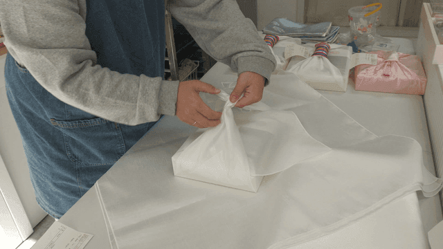 Person who wraps gifts with traditional Korean bojagi
