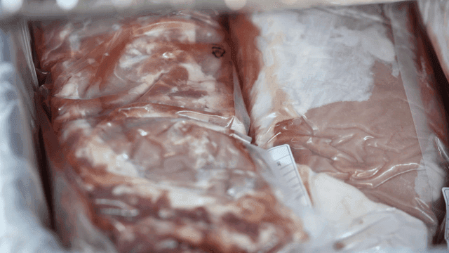 Packaged raw meat in a freezer