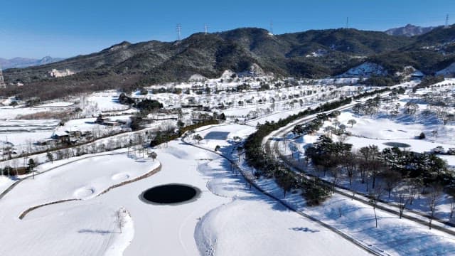 Winter landscape with snowy mountains and roads