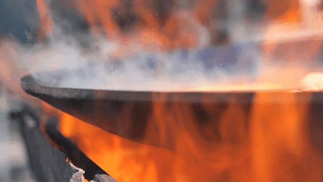 Flames with smoke rising from fan