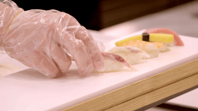 Chef preparing sushi with precision