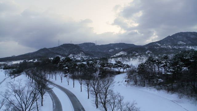 Serene Snowy Mountain Landscape and Road