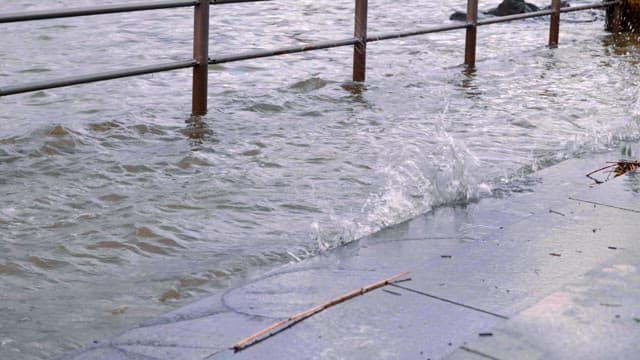 River overflowing beyond the fence