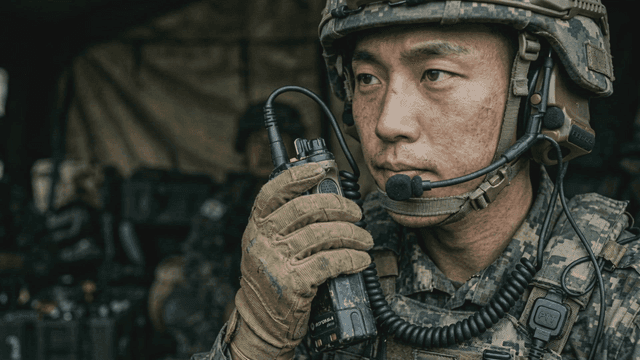 Soldiers communicating via radio