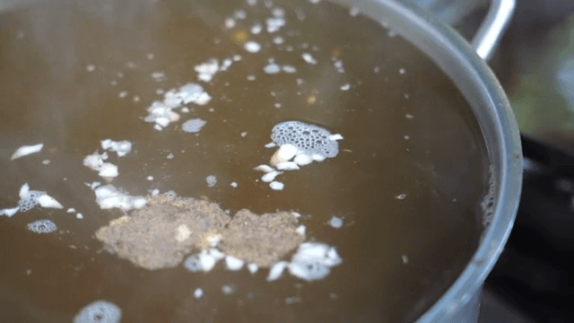 Steaming broth in a pot