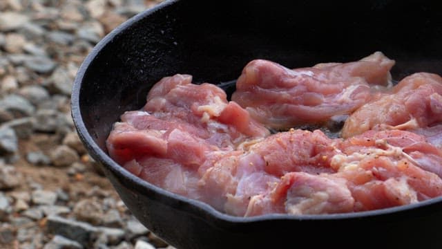 Cook the seasoned chicken in an oiled frying pan