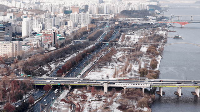 Winter cityscape with river and bridges