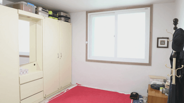 Tidy room with a window and wardrobe