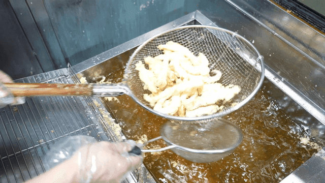Frying calamari in hot oil