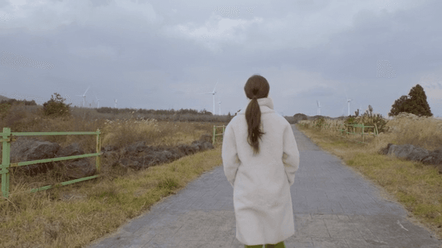 A woman walking on a rural path