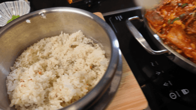 Video of rice scooped out with ladle
