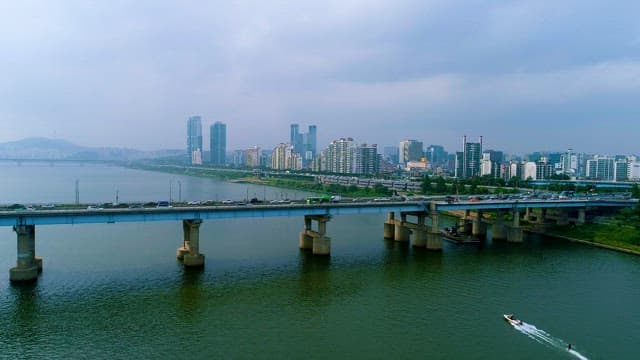 Busy Riverside Cityscape on a Cloudy Day