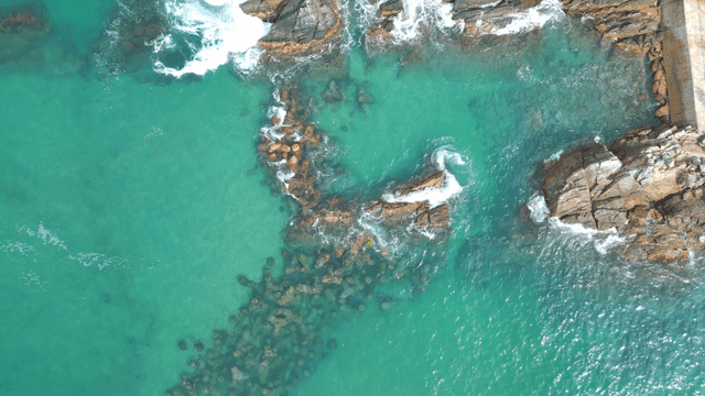 Waves crashing on rocky shoreline