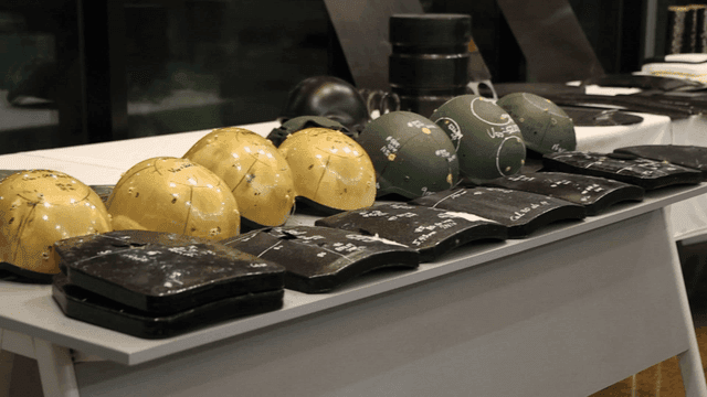 Protective helmets and armor on display