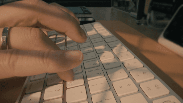 Hands typing on keyboard