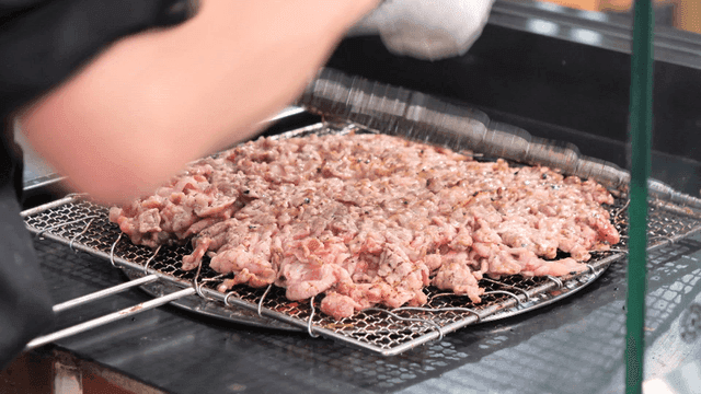 Charcoal briquette bulgogi on wire mesh