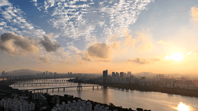 City skyline with river at sunrise