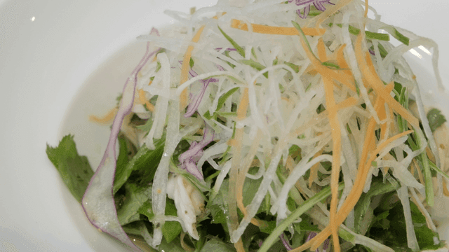 Fresh vegetable salad with shredded radish
