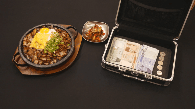 Cheese iron plate jajangmyeon beside a money bag
