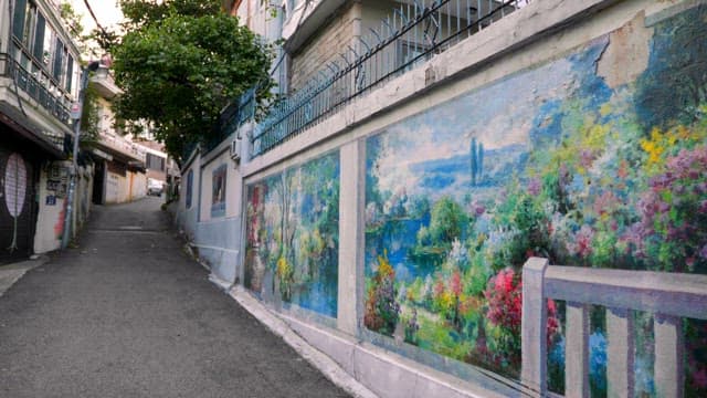 Colorful murals on a quiet alley wall