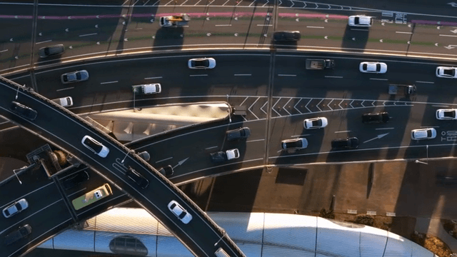 Busy highway intersection with cars