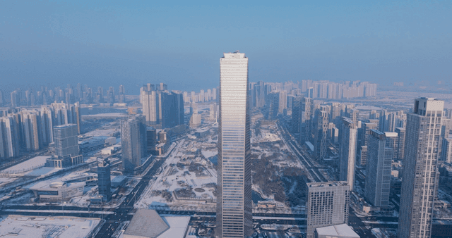 Snow-covered cityscape with tall skyscrapers