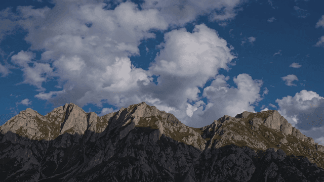 Majestic mountains under a cloudy sky
