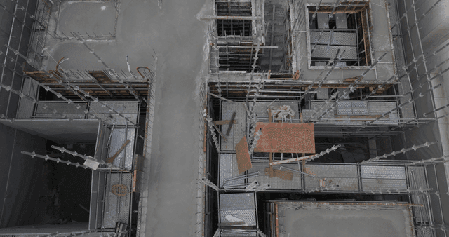 Construction site with scaffolding and concrete