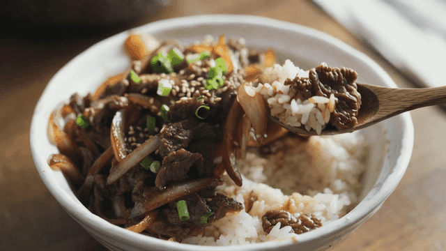 Beef bulgogi rice bowl eaten with spoon