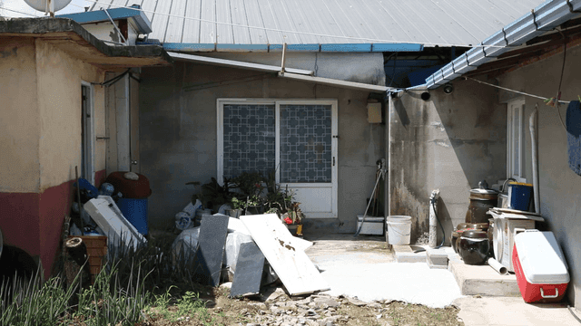 Country house with various items in yard