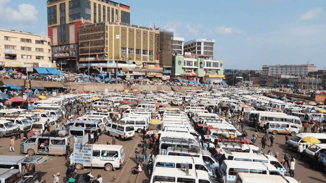Busy urban area with many parked vans