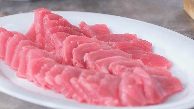 Freshly sliced tuna on a white plate