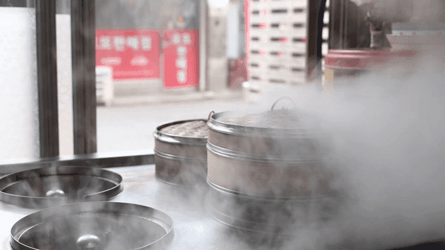 Steaming bamboo steamers in a kitchen
