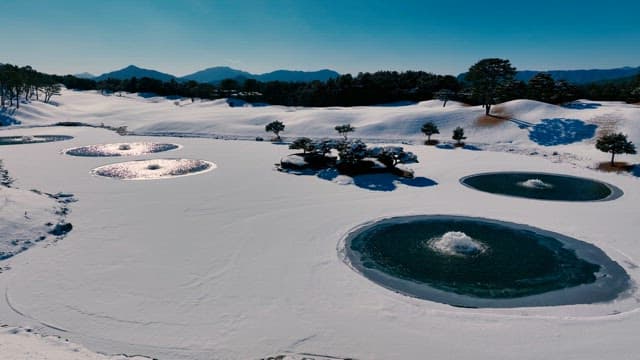  Snowy Landscape with Frozen Ponds