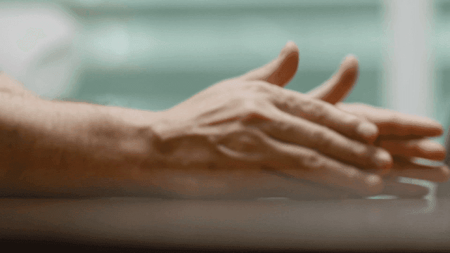 Man's hand gesturing while talking