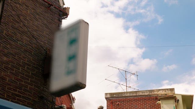 Sunny day with urban brick walls and antennas