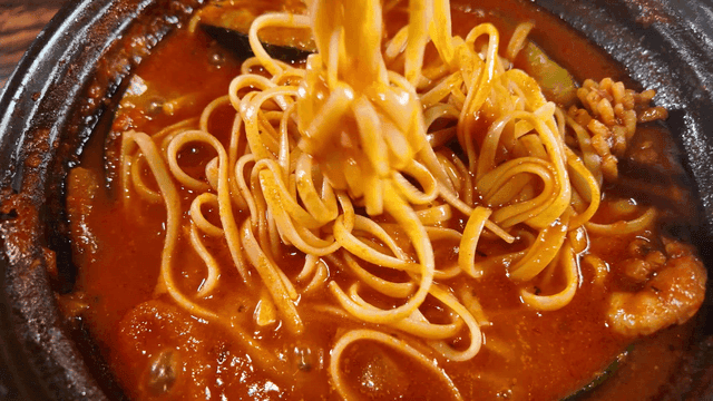 Spicy stew noodles eaten with chopsticks