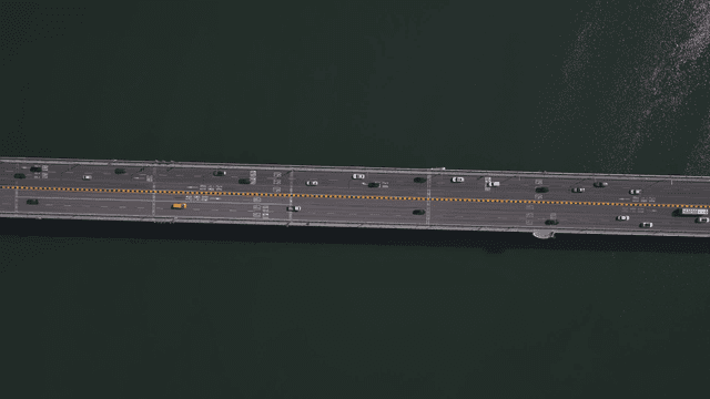 Aerial view of a busy bridge with cars