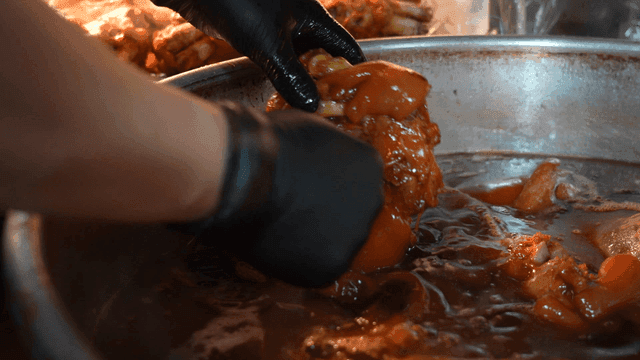 Cooking pig's feet in a large pot
