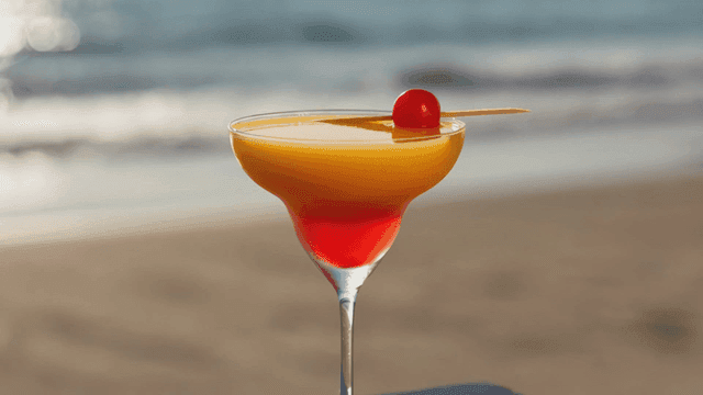 Fancy cocktails on beach table