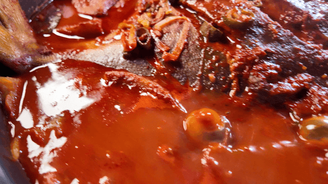 Spicy braised duckfish boiling in pot