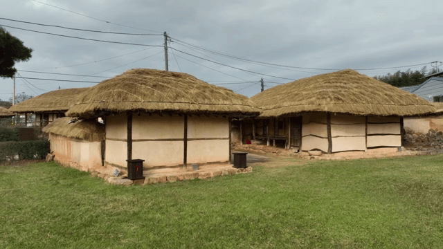 Traditional Korean house with thatched roof