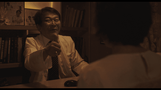 Happy doctor and patient handing red money envelope