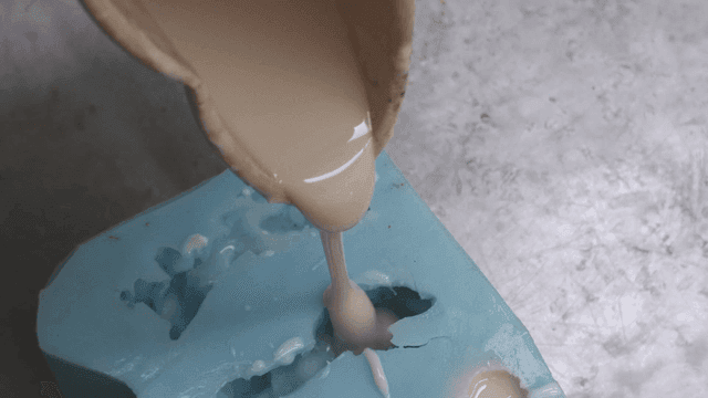 Silicone liquid being poured into mold